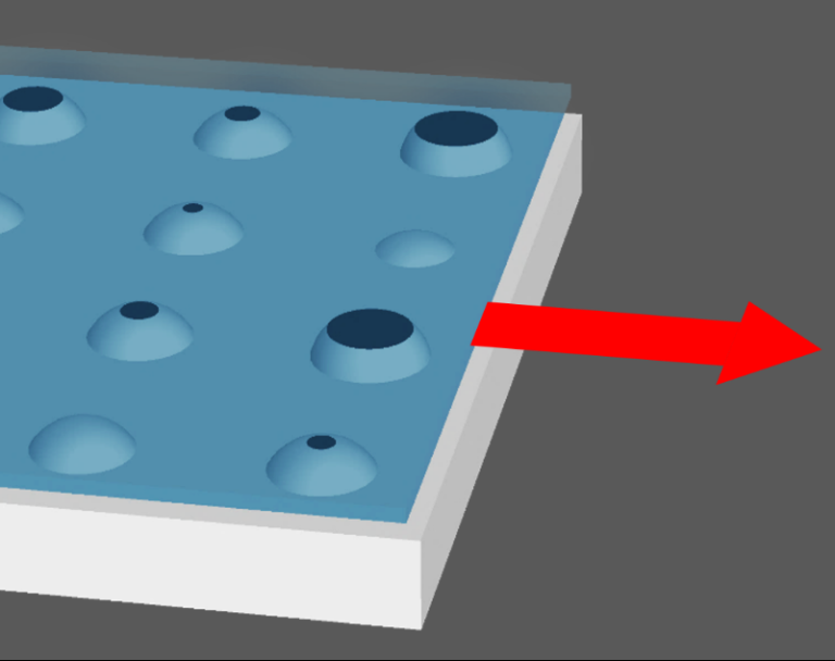 Contact entre un matériau élastique texturé par des aspérités sphériques et une plaque rigide lisse. Les zones noires sont les zones de contact intime entre les deux solides. La flèche rouge indique le mouvement de glissement imposé à la plaque.